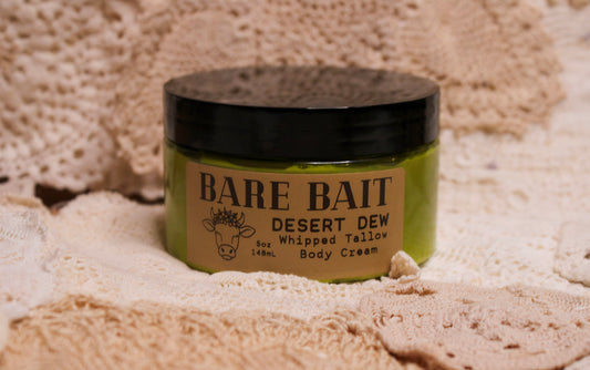 Jar of Bare Bait Desert Dew whipped tailow body cream on a textured beige background